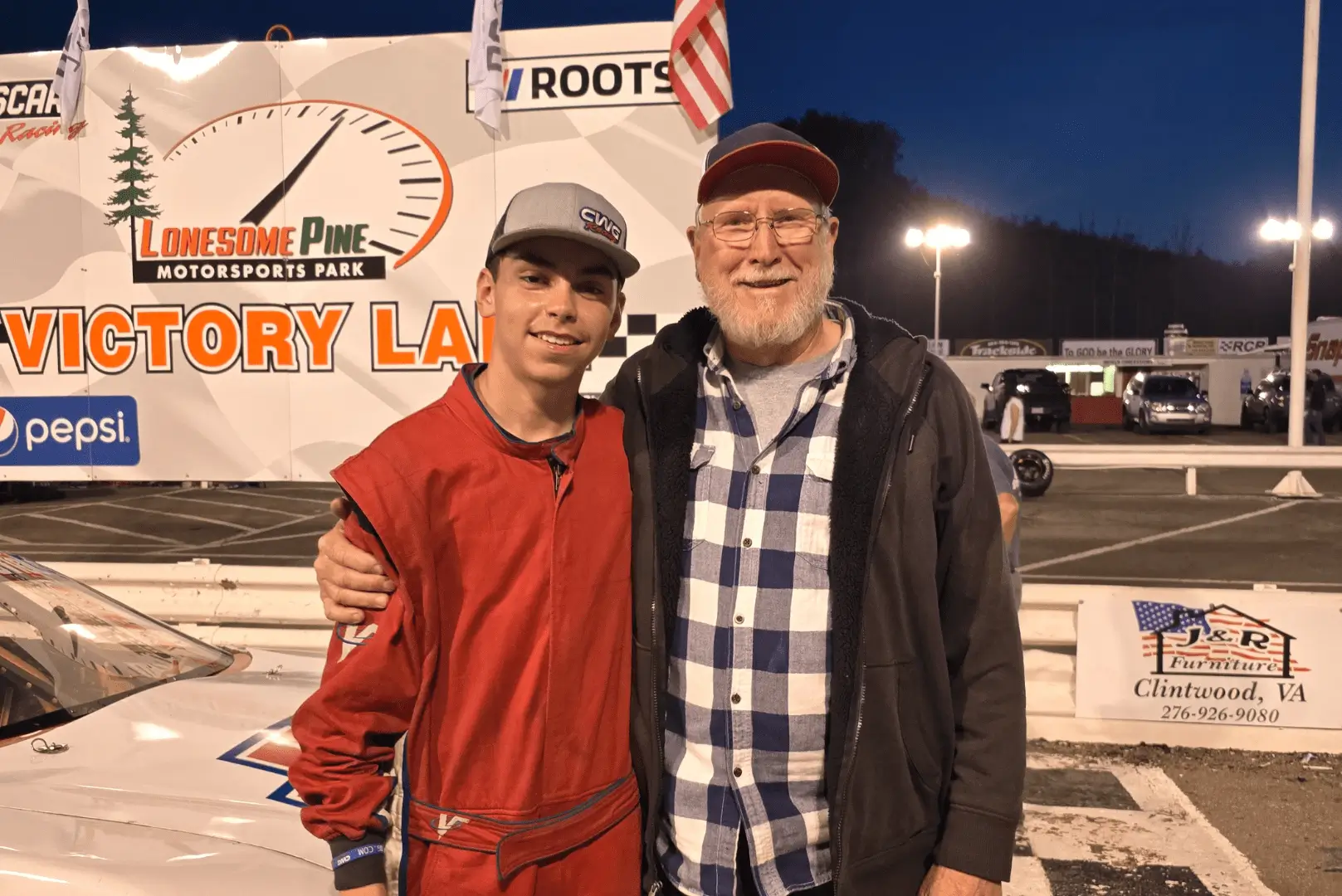 A man and a boy standing next to each other.